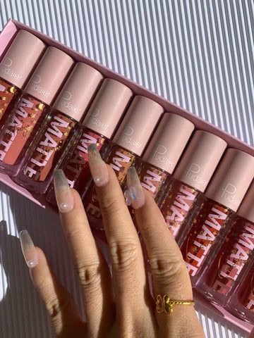 Swatch of Soft Powder lip color applied on light skin