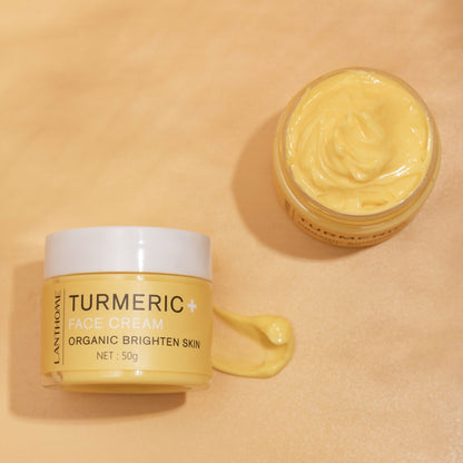 Travel-sized Milk Face Cream next to skincare tools on a vanity.